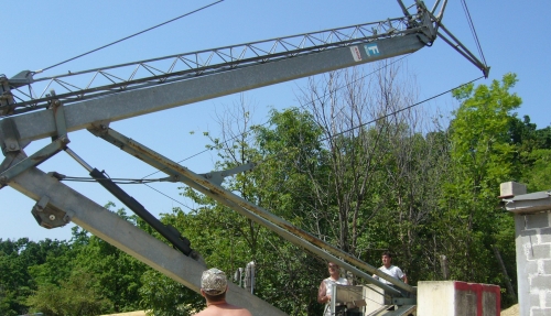 Installing a crane prior to assembling a house