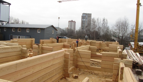 Building a wooden house from larch two-edged cant